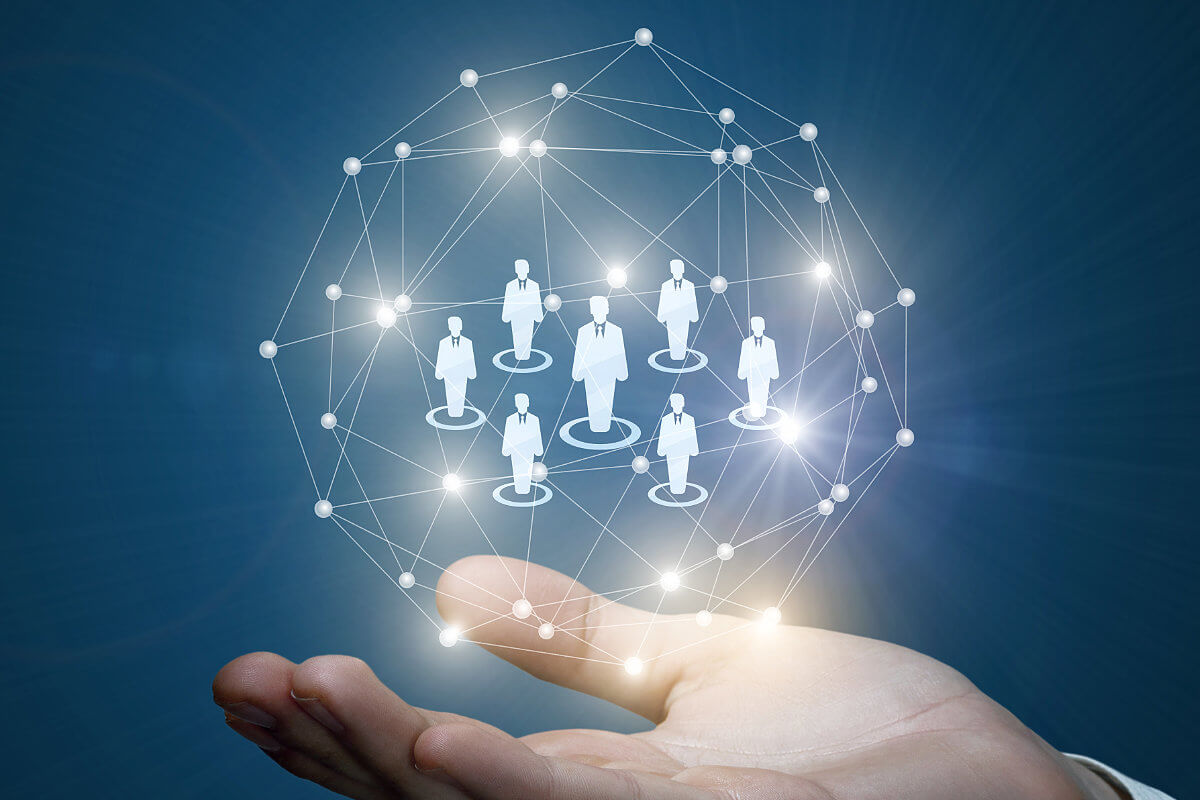 Hand holding global cloud-based information exchange concept